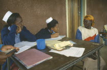 Nurses taking patient s notes at Ortum hospital mobile clinic.