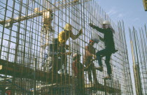 Construction workers on building site.