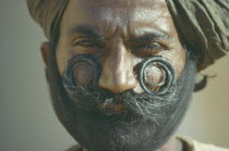 Portrait of sikh man with curled  waxed moustache.