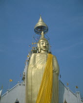 Wat Indrawiharn. Standing Buddha wearing orange sash  containing relic of Buddha from Sri Lanka.