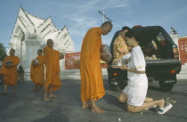 Monks collecting Alms outside Marble Temple. Wat Benchamabophit