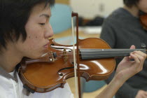 Teenager playing first violin in United Freedom OrchestraYosuke Shina 18 years old 3rd year high school