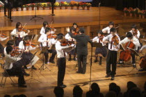 The spring concert of United Freedom Orchestra. Teenages performing Violin duet on stage.Koji Katsuyama  lft  and Nakamura  both 18 year old high school seniors  play violin duet