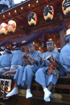 Narita Gion Festival. Men on festival wagon dressed in Edo era costumes with man called Yukata playing traditional drums and flute Edo ancient name for tokyo