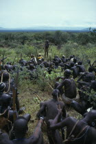 Mursi tribe listening to story teller.