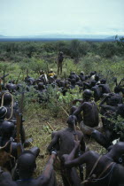 Mursi tribe listening to story teller.