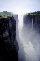 Waterfall plummeting over 355ft sheer cliff face in to a narrow chasm.
