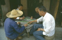 Playing game of majong.