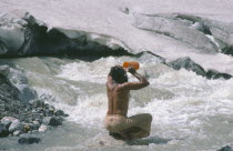 Pilgrim bathing at Gormuich or the Cows Mouth source of the River Ganges.Gaumukh