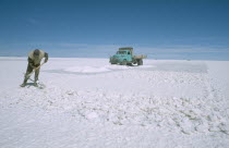 Salar de Uyuni.  Miner on expanse of salt flats near Colchani.