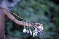 Cropped shot of extended arm displaying kula necklace.