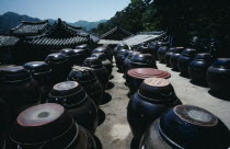 Kimchi pots containing pickled cabbage eaten as part of every meal outside Haeinsa Temple.