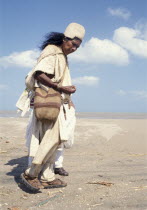 Kogi Mama or Holy Man searching for shells