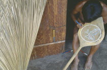 A Macuna Indian painting design depicting fish onto wooden oar.Tukano or Tucano group