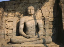 Gal Vihara.  Mid twelth century seated Buddha figure carved from granite.11th -13th Century capital