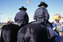 USA, New Mexico, Albuquerque, Mounted Police at the InternationalHot Air Balloon Fiesta.