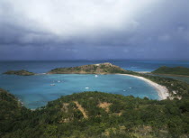 Deep Bay.  View from above over bay with moored boats  and surrounding coastline.