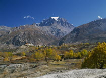 View over Jhong Khola Valley and the Thorung La pass to distant fortress town and Yakawa Kang mountain.