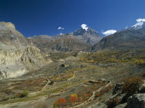 View over Jhong Khola Valley and the Thorung La pass to distant fortress town and Yakawa Kang mountain.