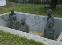 Stone Town. Sculpture depicting five slaves chained in a pit in the grounds of the Cathedral Church of Christ Anglican Cathedral.