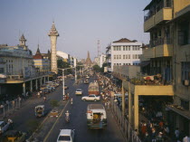 View over busy pavements  city architecture and wide  central road.