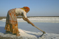 Woman gathering salt