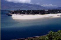 View over beach and lagoon with moored boats