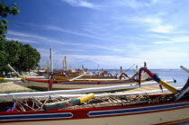 View over row of colourful Outrigger fishing boats on the Beach