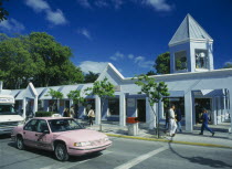 Pink Taxi on Duval Street with single storey shopsStrip Mall