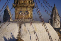 Swayambhunath Temple roof with painted face decorated with prayer flags