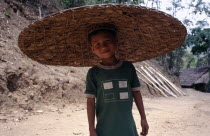 Mae Yet camp. Karen refugee boy wearing a wide brimmed circular hat