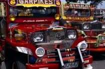 Victorias. Close up of two brightly painted Jeepneys