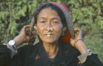 Woman with nose jewellery  head and shoulders portrait.