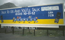 Peoples Phone billboard advertisment poster on Falls Road dawbed with Sinn Fein grafitti  Belfast