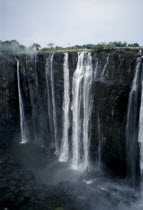 Zambezi River Victoria Falls. Waterfall plummeting 355 feet over a sheer cliff face.