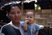 Portrait of Karen refugee mother holding child