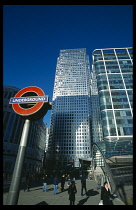 Canary Wharf. The tower at 1 Canada Square with Underground station sign in the foreground.  Tube
