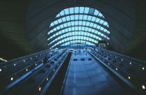 Canary Wharf Underground station escalators and glass roof.  Tube