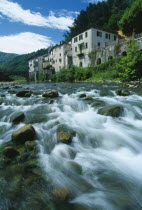 Bagni di Lucca.  Riverside buildings of historic spa town and bridge over the River Lima.