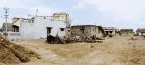 Houses heavily damaged by the Indian Ocean Tsunami of 26th December 2004.natural disasterfishing boats
