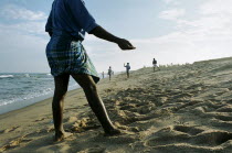 South Indian fishermen return to beach-casting 5 weeks after the Indian Ocean Tsunami that hit the coast on 26th December 2004.fishingfishing linefishing linescoastline