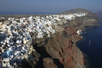 Cliff top view over the towns architecture with different coloured domed buildings.