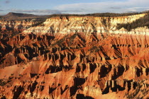 This National Monument contains a steep  bowl-shaped cliff face with colourful rock strata and many strange rock shapes.