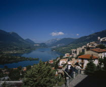 The village perched on the side of the mountain. Lago di Barrea  lake.