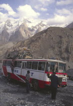 Bus negotiating a flooded river on the Karakorum highway on route to China from Pakistan