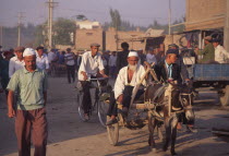 Tajik men on donkey cart