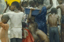 UNICEF water project.  Crowd of children with bowls.