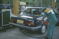 Refuelling car at alcohol fuel station.Automobile Brasil