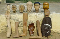 Voodoo offerings.  Images are made to request a favour.  Votive images indicate which part of the body will be affected when pins are inserted. Brasil