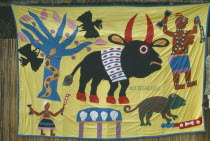Voodoo symbols on embroidered banner.